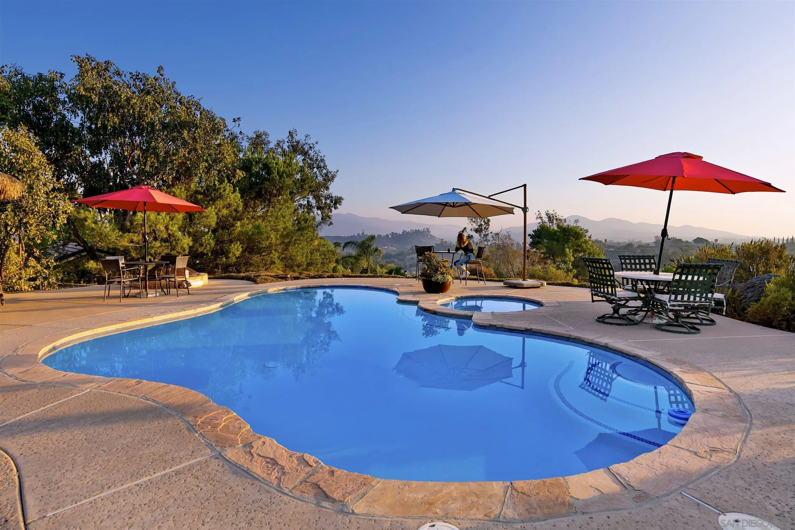 3480 Hidden Trail Drive Jamul, CA 91935 - Photo 3 of 38 a view of a swimming pool with chairs in patio