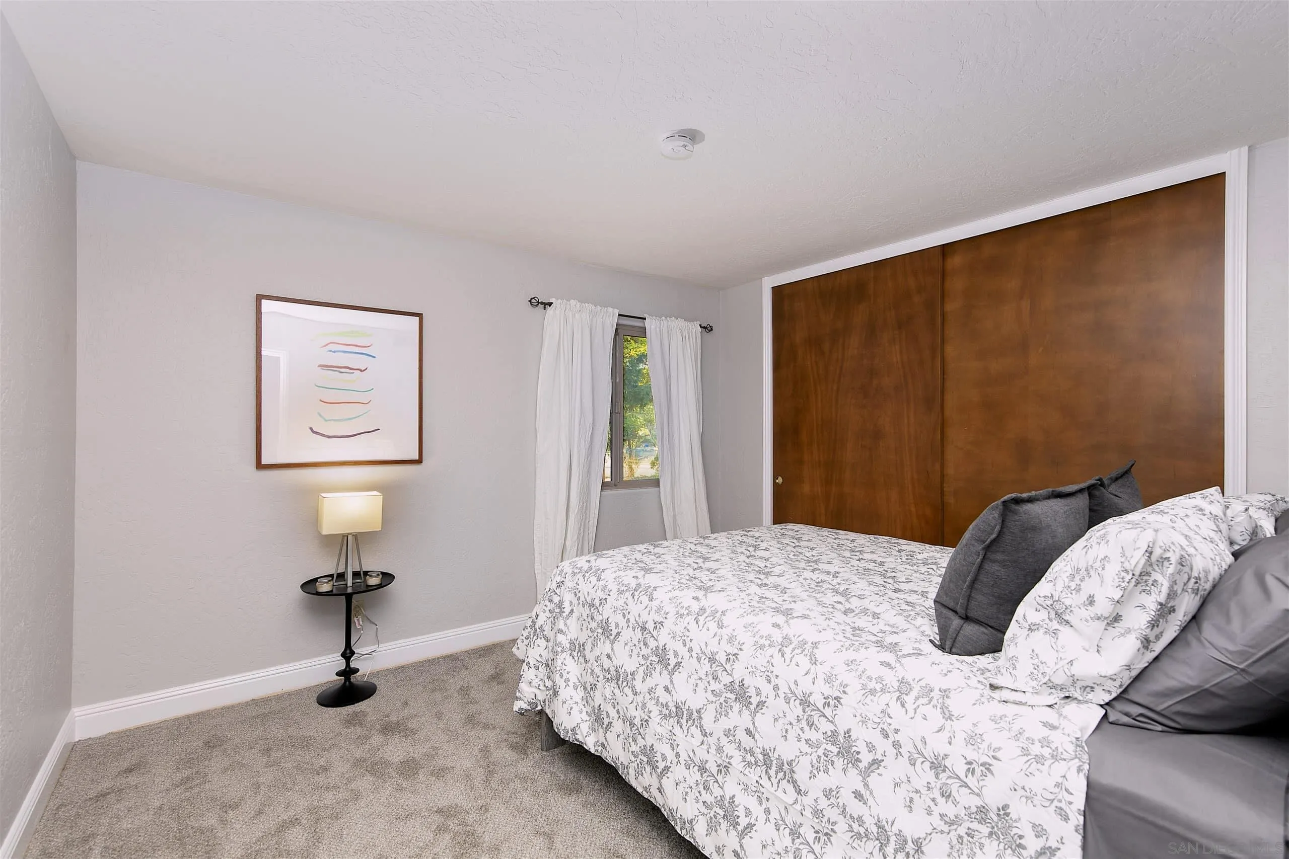 3480 Hidden Trail Drive Jamul, CA 91935 - Photo 33 of 38 a bedroom with a bed and a window