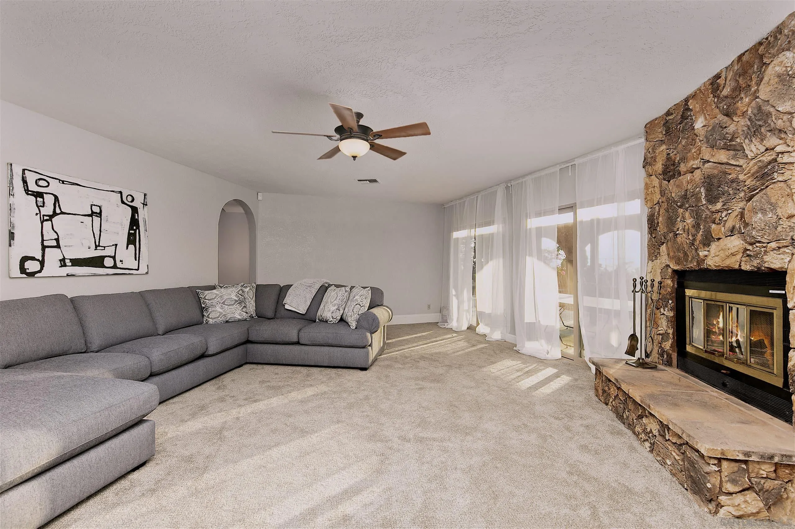 3480 Hidden Trail Drive Jamul, CA 91935 - Photo 34 of 38 a living room with furniture and a fireplace