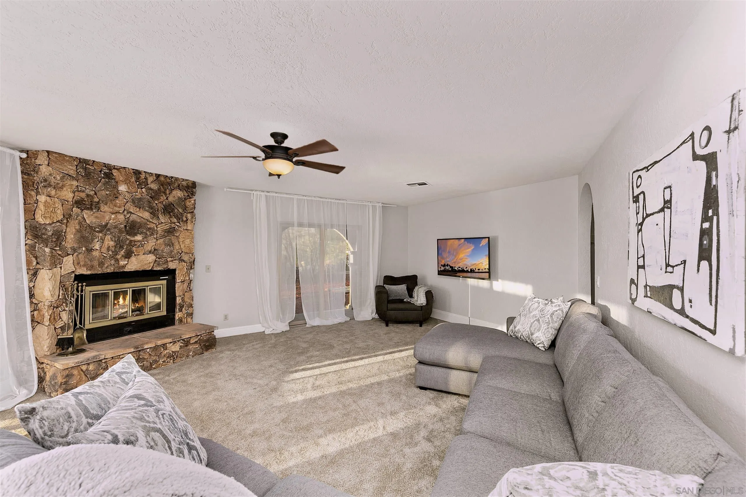 3480 Hidden Trail Drive Jamul, CA 91935 - Photo 36 of 38 a living room with furniture and a fireplace