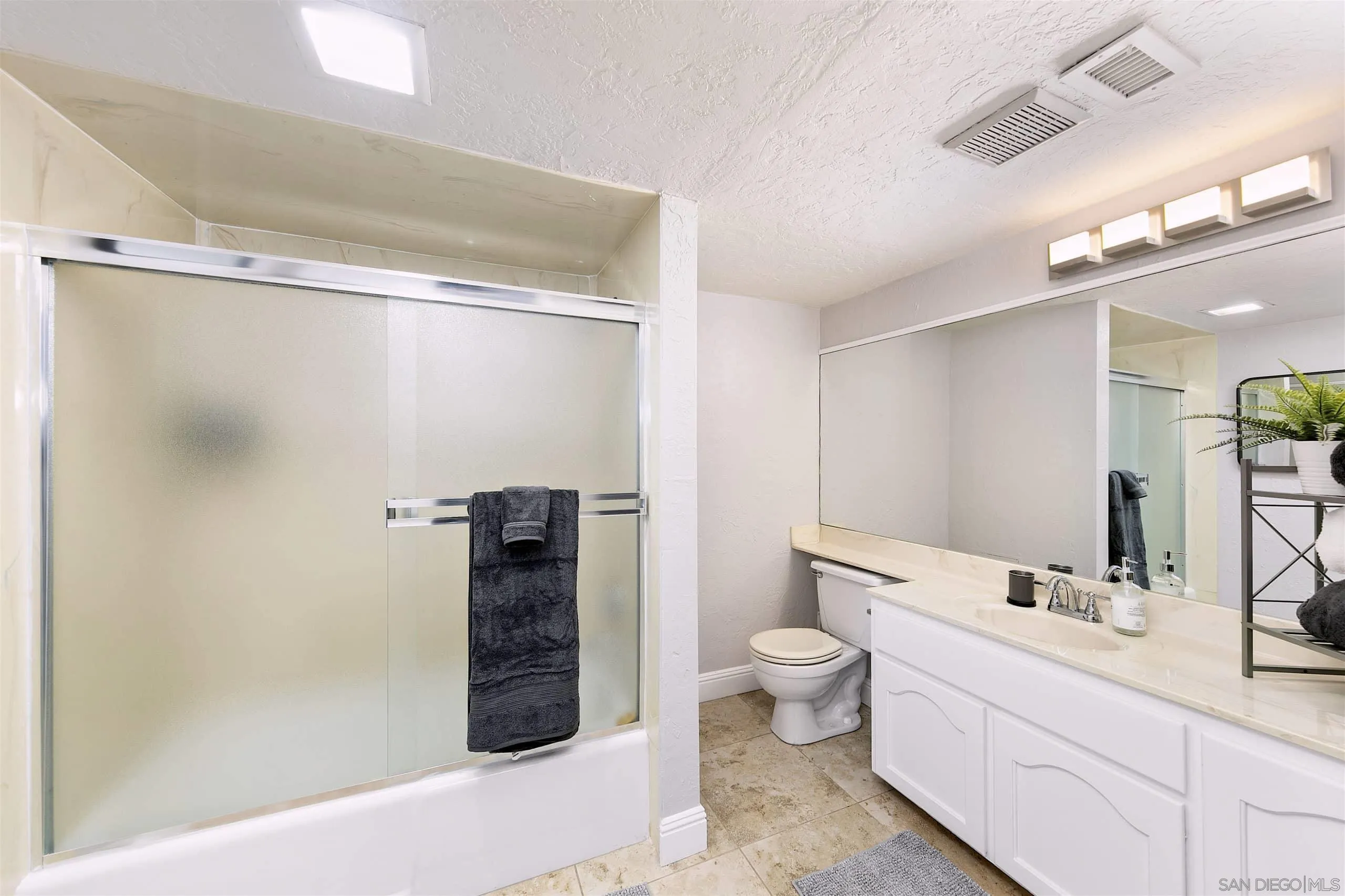 3480 Hidden Trail Drive Jamul, CA 91935 - Photo 37 of 38 a bathroom with a double vanity sink and mirror