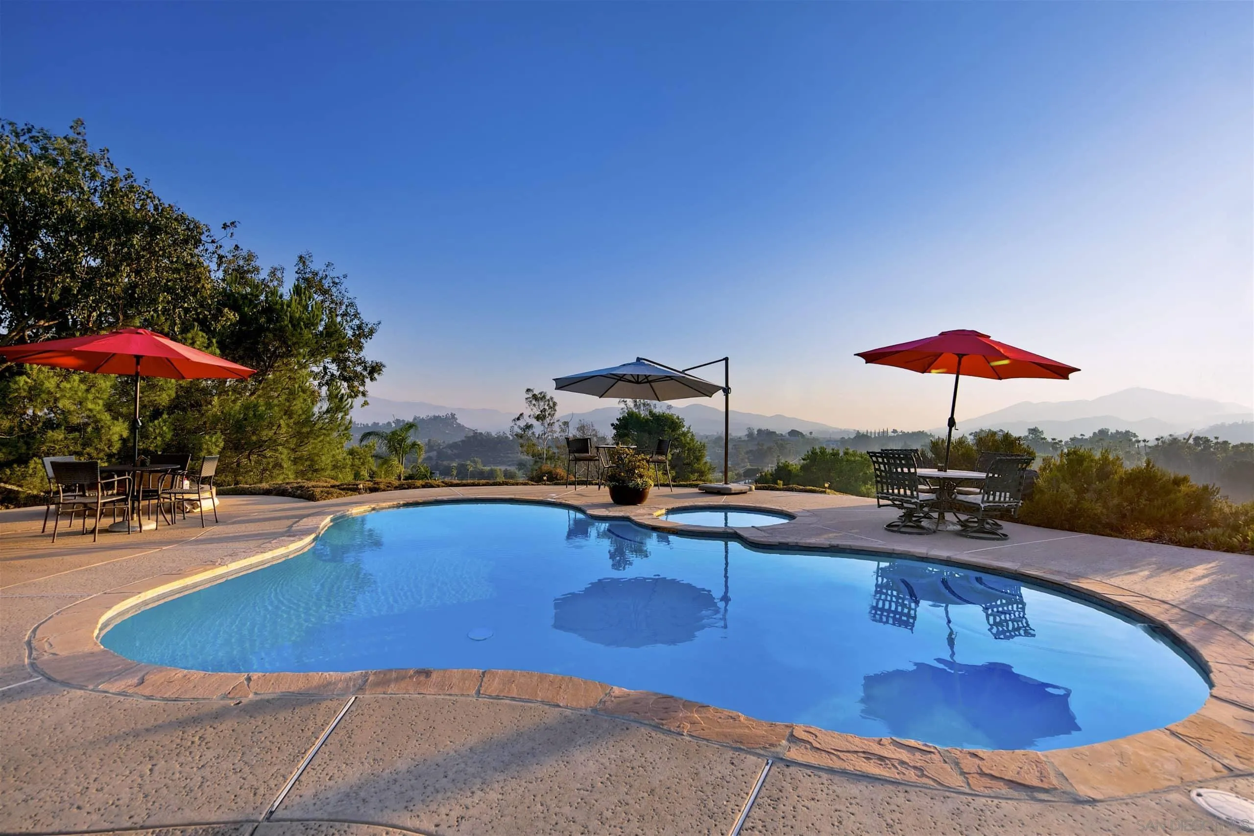 3480 Hidden Trail Drive Jamul, CA 91935 - Photo 6 of 38 a view of a swimming pool with a table and chairs