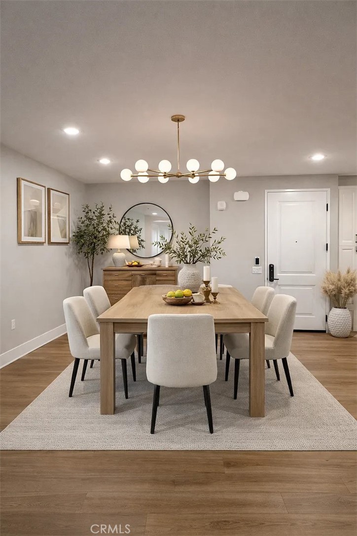 16450 Veterans Way, Unit 308 Tustin, CA 92782 - Photo 5 of 11 a view of a dining room with furniture