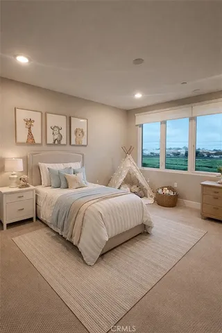 a spacious bedroom with a large bed and a large window