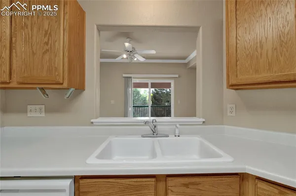 a bathroom with a sink and a window