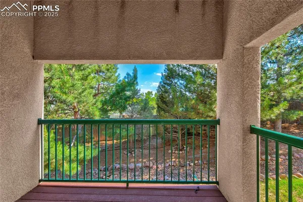 a view of balcony with wooden floor