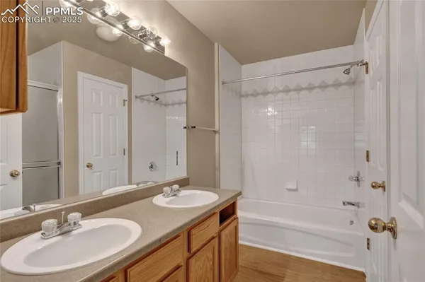 a bathroom with a shower and a bath tub