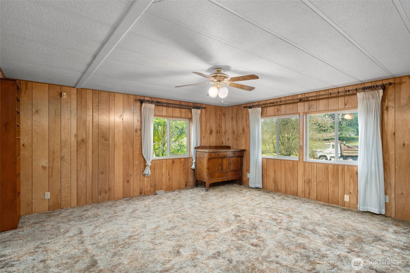 28624 168th Avenue Southeast Kent, WA 98042 - Photo 12 of 31 an empty room with windows and a ceiling fan