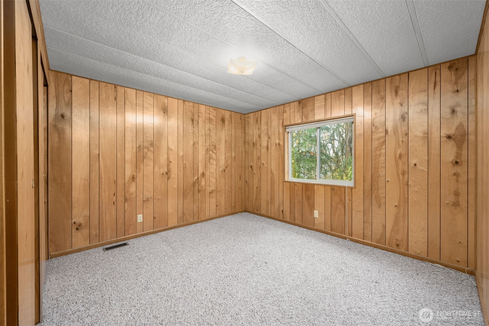 28624 168th Avenue Southeast Kent, WA 98042 - Photo 19 of 31 a view of an empty room with a window and a curtain