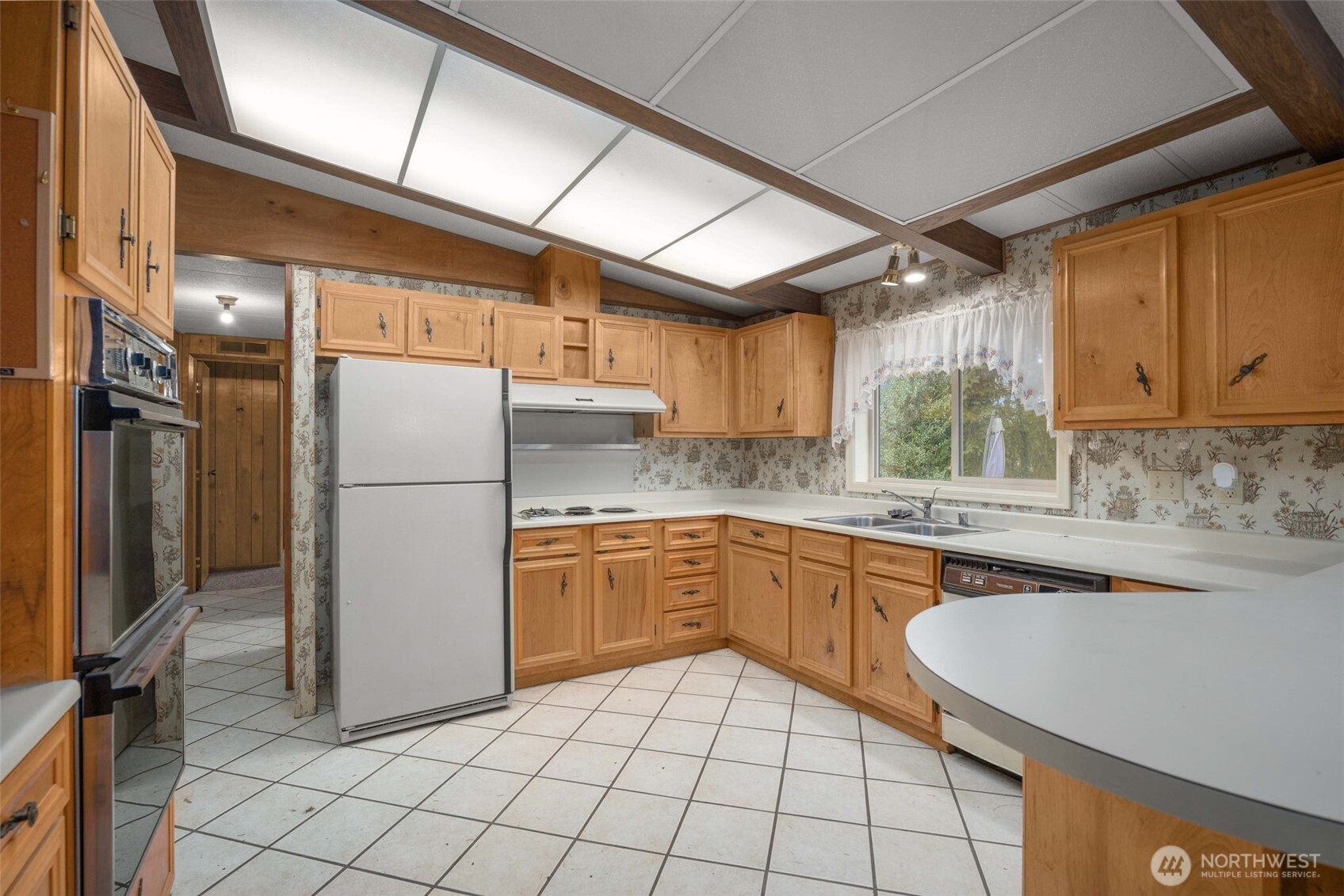 28624 168th Avenue Southeast Kent, WA 98042 - Photo 3 of 31 a kitchen with sink cabinets and refrigerator