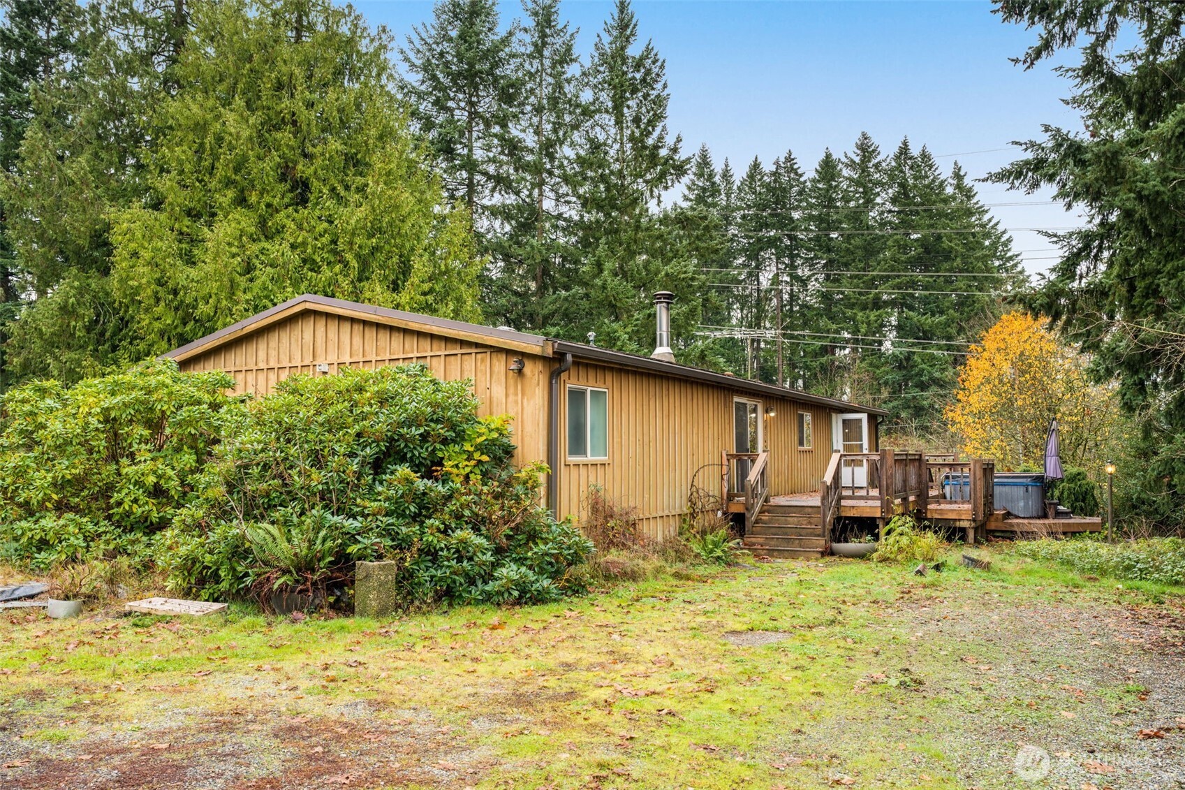 28624 168th Avenue Southeast Kent, WA 98042 - Photo 31 of 31 a backyard of a house with wooden fence and large trees
