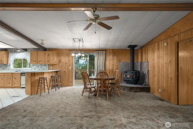 a view of a dining room with furniture window and outside view