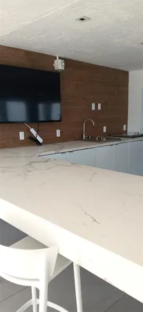 a view of a hallway with a chandelier