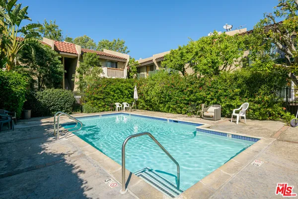 a view of a swimming pool with a patio