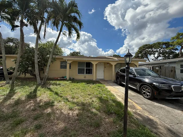 a view of a porch with furniture and a fire pit