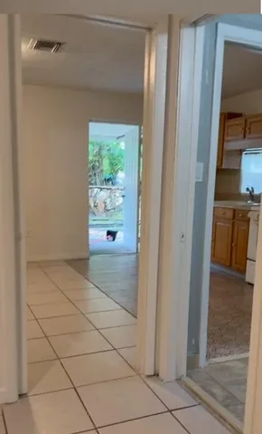 a kitchen with a sink a stove and refrigerator