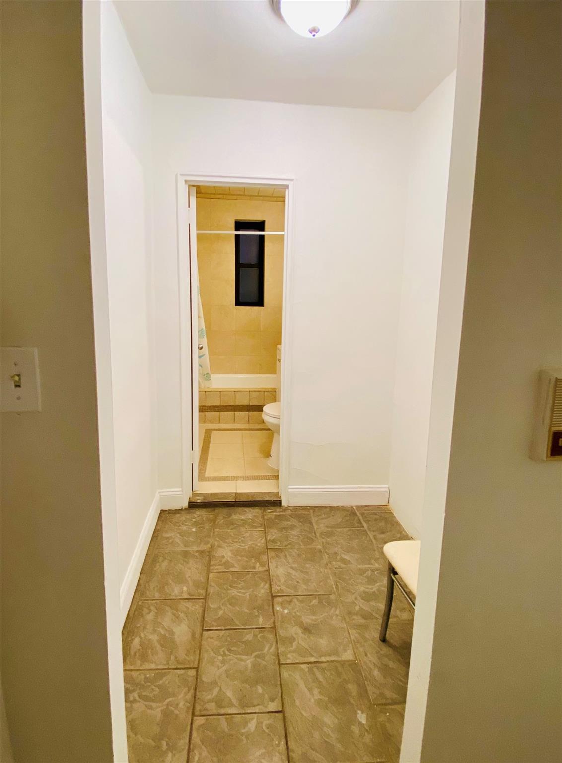 150-25 72nd Road, Unit 1E Queens, NY 11367 - Photo 3 of 7 a view of a room with a sink