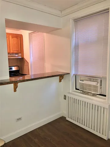 a kitchen with a window a sink and a counter top space