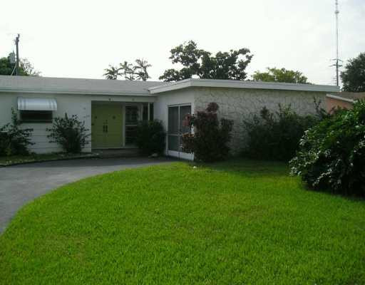3605 East Shore Road Miramar, FL 33023 - Photo 1 of 1 a front view of a house with garden