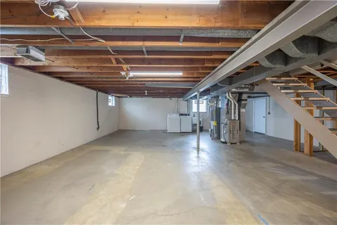a view of empty room with wooden ceiling