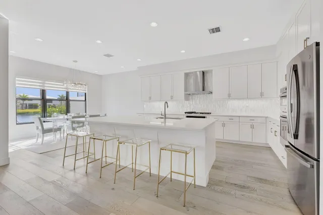 a aerial view of a house with swimming pool lawn chairs and fire pit