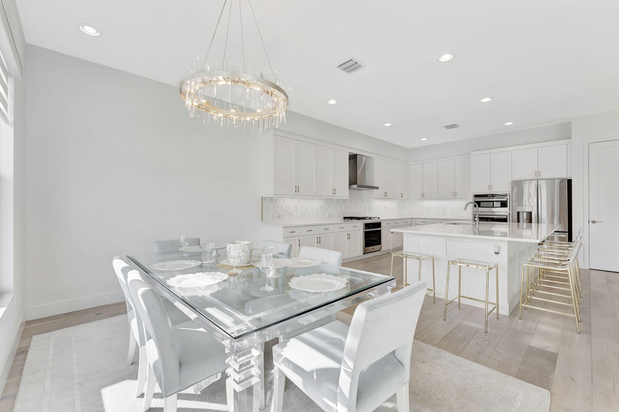 20046 Pacific Dunes Drive Boca Raton, FL 33434 - Photo 18 of 130 a view of kitchen with sink dining table and chairs
