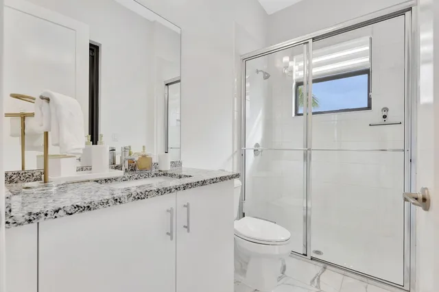 an aerial view of multiple houses with yard