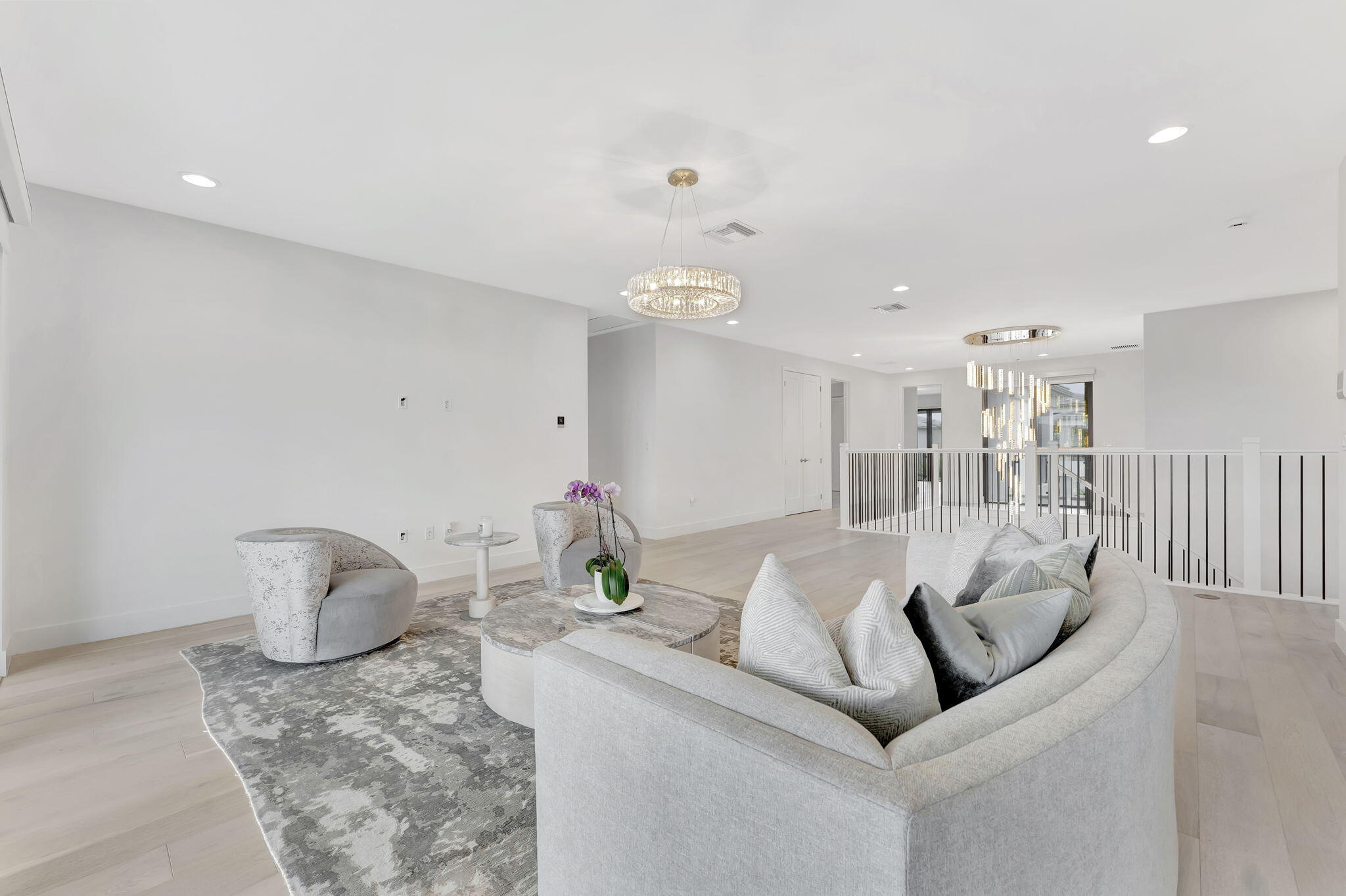 20046 Pacific Dunes Drive Boca Raton, FL 33434 - Photo 32 of 130 a living room with furniture and a chandelier