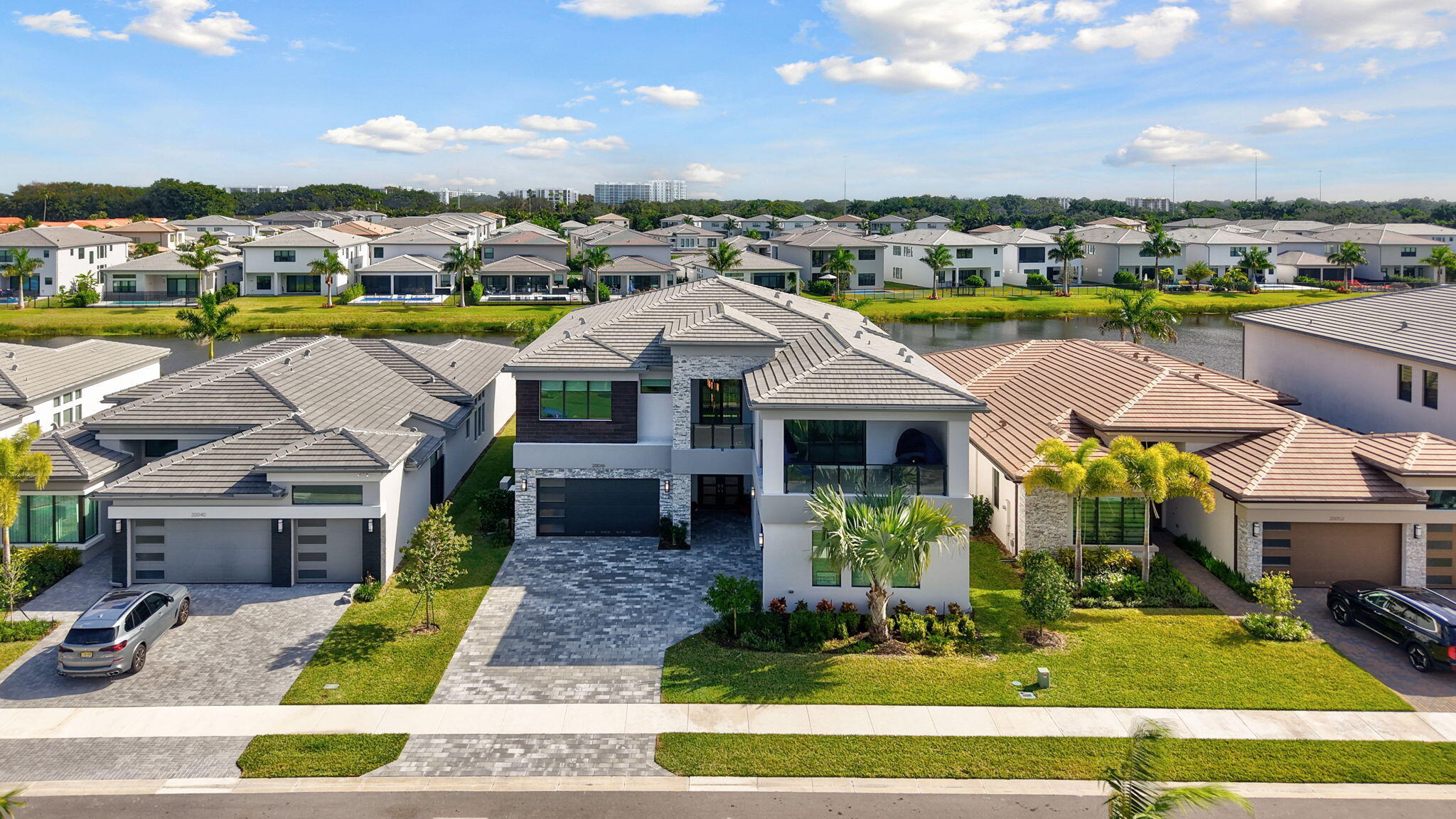 20046 Pacific Dunes Drive Boca Raton, FL 33434 - Photo 70 of 130 a aerial view of a house with swimming pool lawn chairs and fire pit