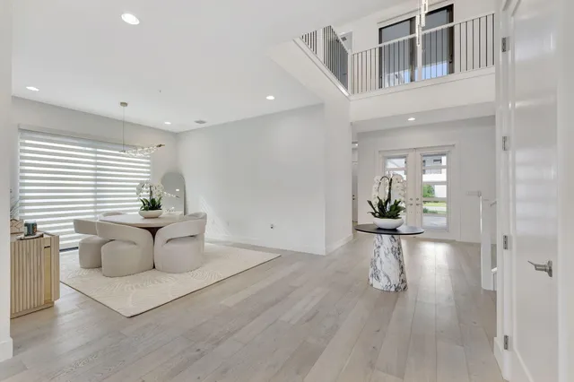 a bathroom with a bathtub a double vanity sink a mirror and a bathtub