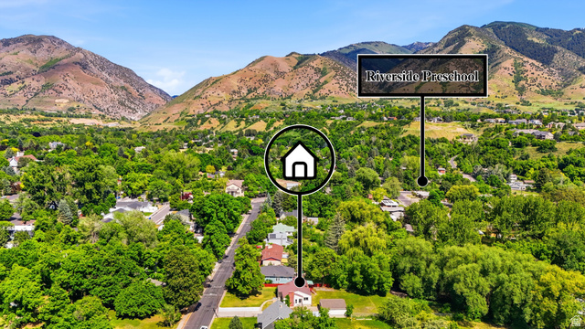 778 East 200 North Logan, UT 84321 - Photo 39 of 43 Aerial perspective showcasing the property's location amidst a lush, tree-filled landscape