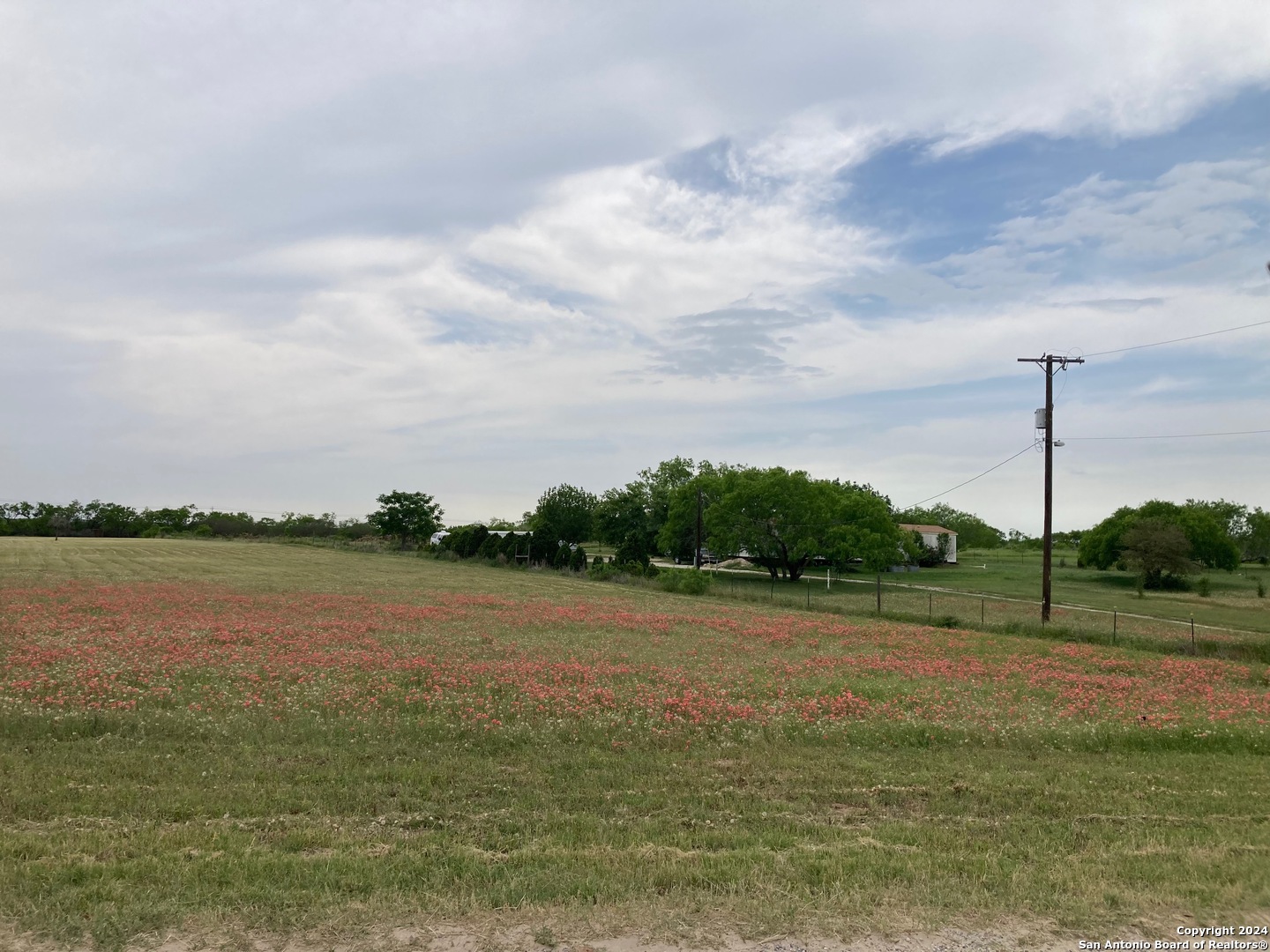 1 County Road, Unit 163 Elmendorf, TX 78112 - Photo 6 of 9 a view of a lake with a big yard