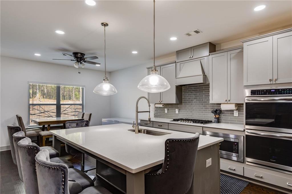 245 Crestbrook Lane Dallas, GA 30157 - Photo 16 of 47 a kitchen with counter space a sink and appliances