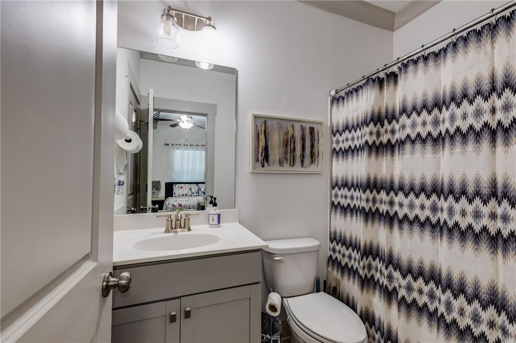 245 Crestbrook Lane Dallas, GA 30157 - Photo 19 of 47 a bathroom with a toilet a sink and mirror