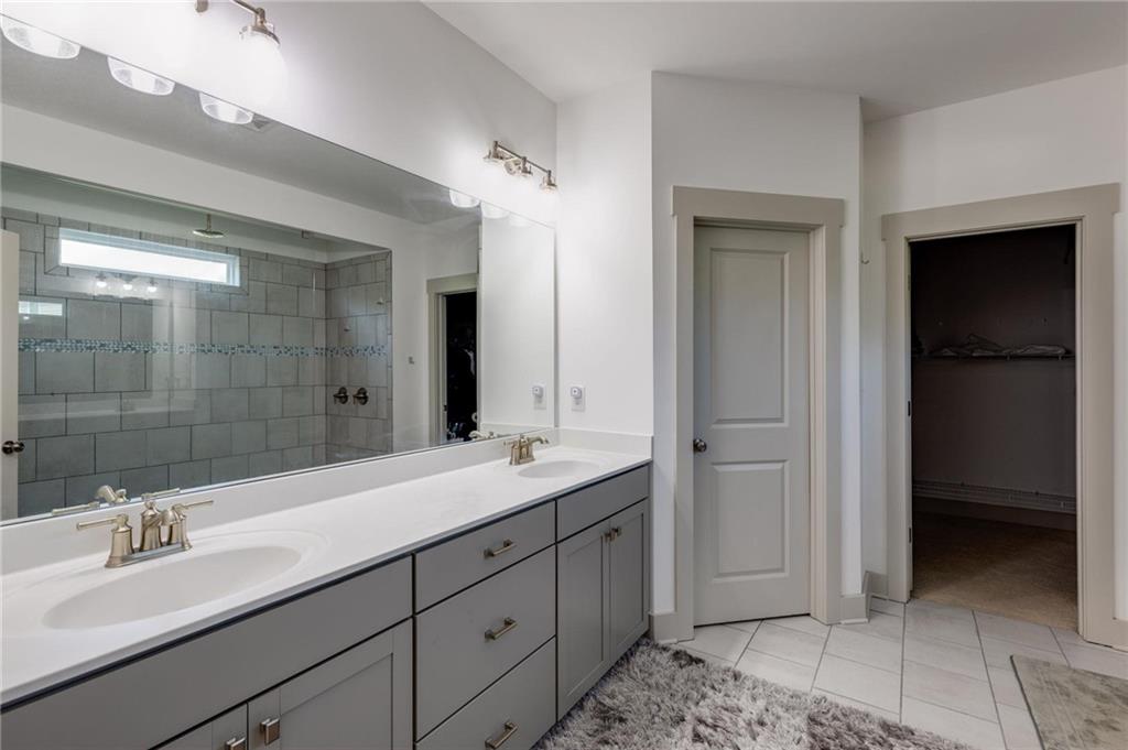 245 Crestbrook Lane Dallas, GA 30157 - Photo 25 of 47 a bathroom with a double vanity sink and mirror
