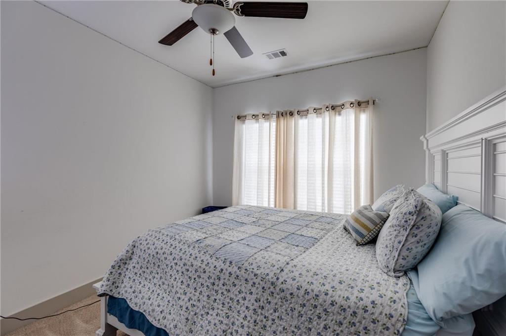 245 Crestbrook Lane Dallas, GA 30157 - Photo 30 of 47 a bedroom with a bed a window and cabinet
