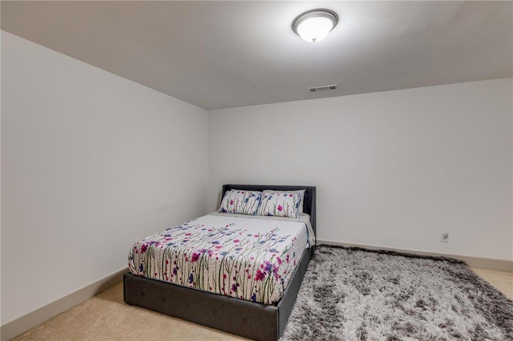 245 Crestbrook Lane Dallas, GA 30157 - Photo 33 of 47 a bedroom with a bed and a window
