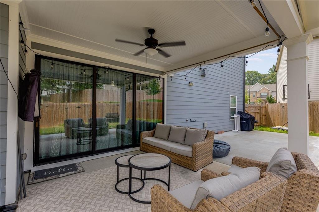 245 Crestbrook Lane Dallas, GA 30157 - Photo 41 of 47 a outdoor space with patio the couches and a dining table with the view of the balcony
