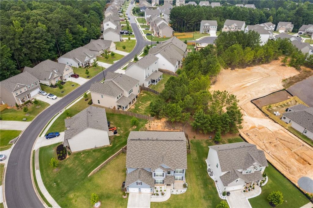 245 Crestbrook Lane Dallas, GA 30157 - Photo 44 of 47 an aerial view of a house with a garden and lake view