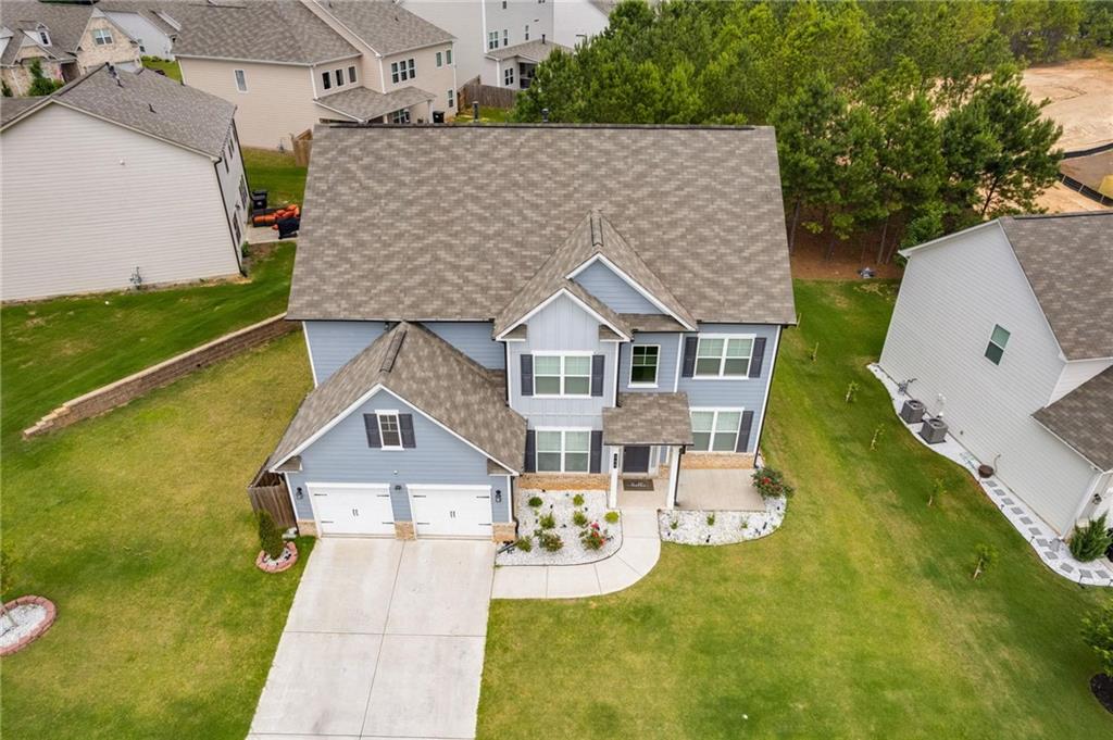 245 Crestbrook Lane Dallas, GA 30157 - Photo 5 of 47 an aerial view of a house with swimming pool and garden