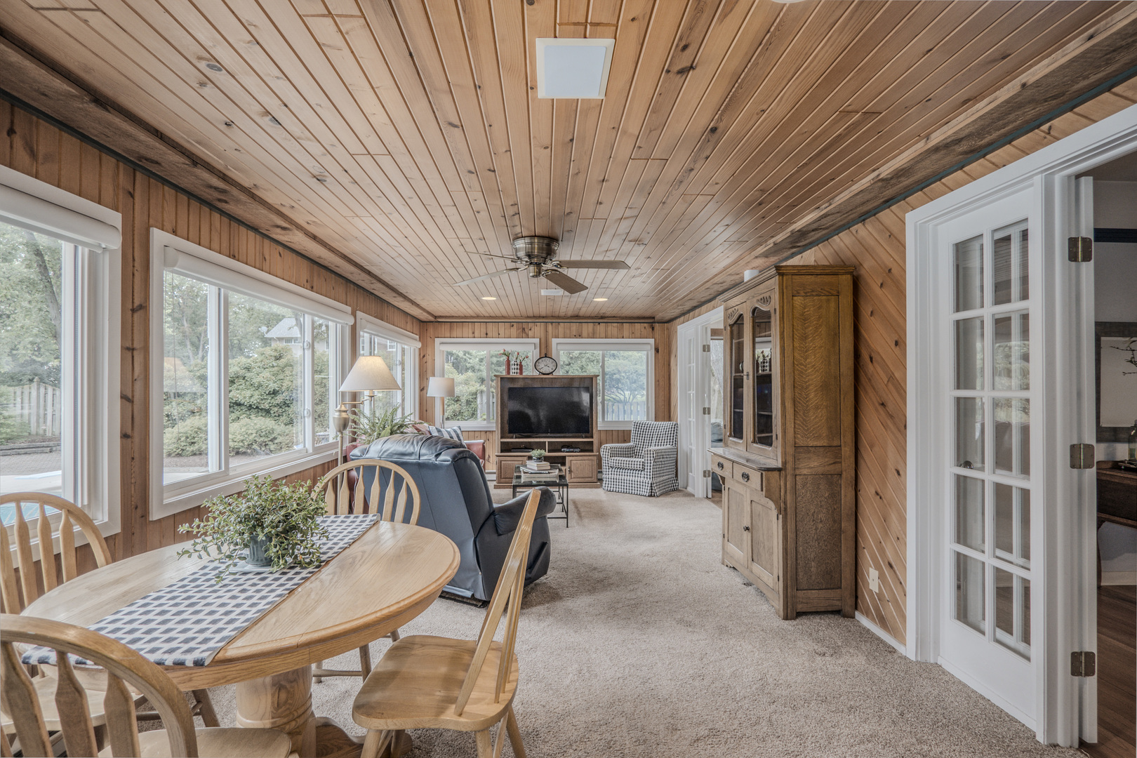 1530 Kaneville Road Geneva, IL 60134 - Photo 17 of 60 a living room with furniture a flat screen tv and a large window