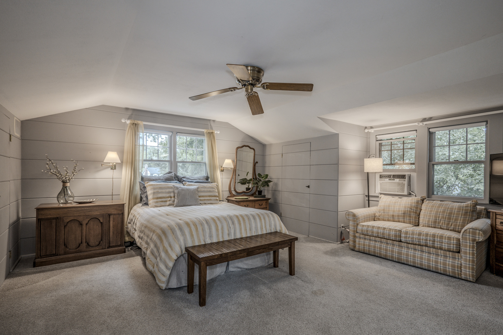 1530 Kaneville Road Geneva, IL 60134 - Photo 26 of 60 a spacious bedroom with a bed a couch and a chandelier