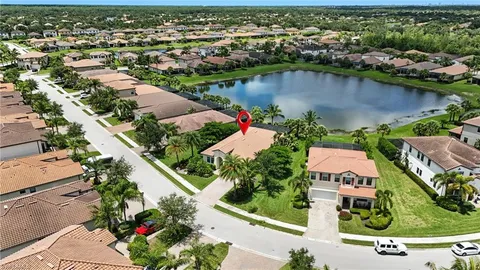 an aerial view of residential houses with outdoor space and street view