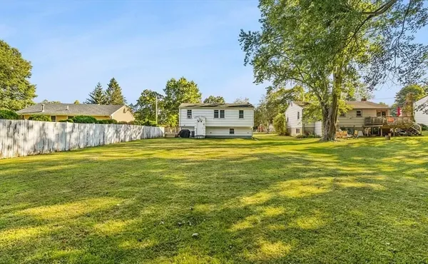 a view of a balcony with wooden floor and fence