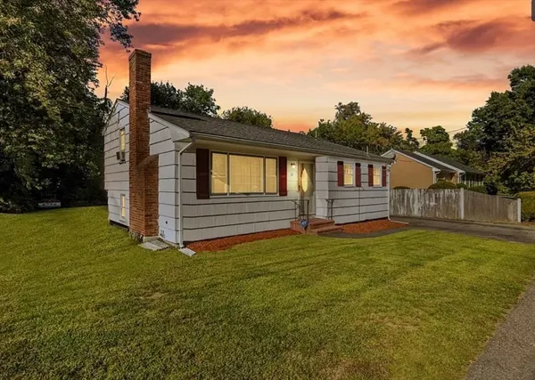 a bedroom with a bed and a fireplace