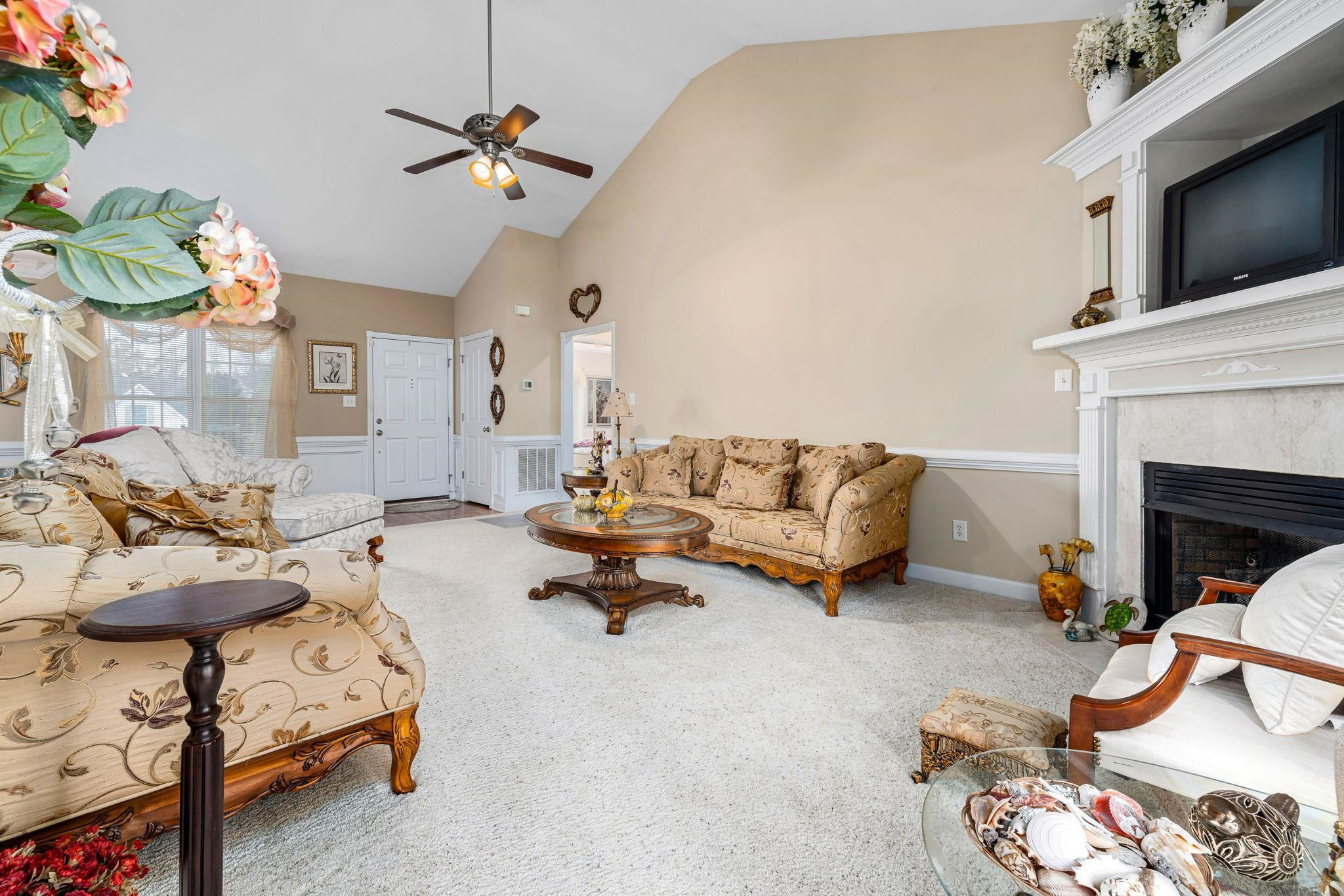 20 Crestline Drive Selma, NC 27576 - Photo 15 of 40 a living room with furniture and a fireplace