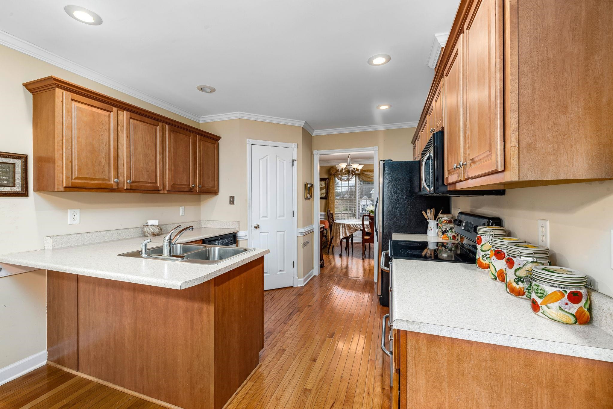 20 Crestline Drive Selma, NC 27576 - Photo 18 of 40 a kitchen with a sink a stove and cabinets