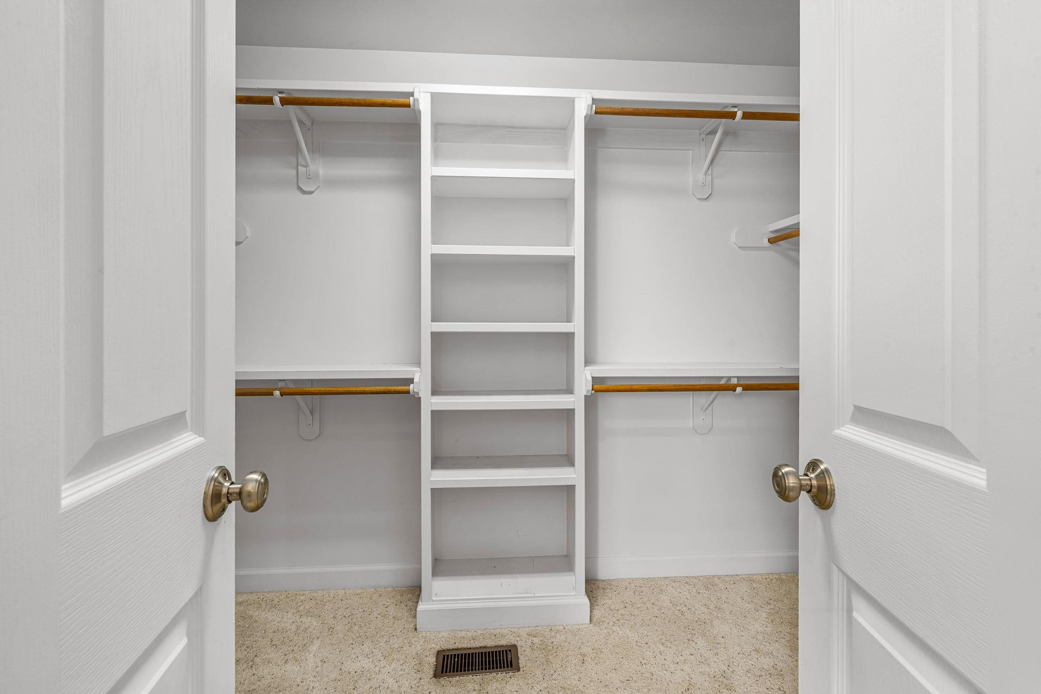 20 Crestline Drive Selma, NC 27576 - Photo 30 of 40 a view of walk in closet with empty racks