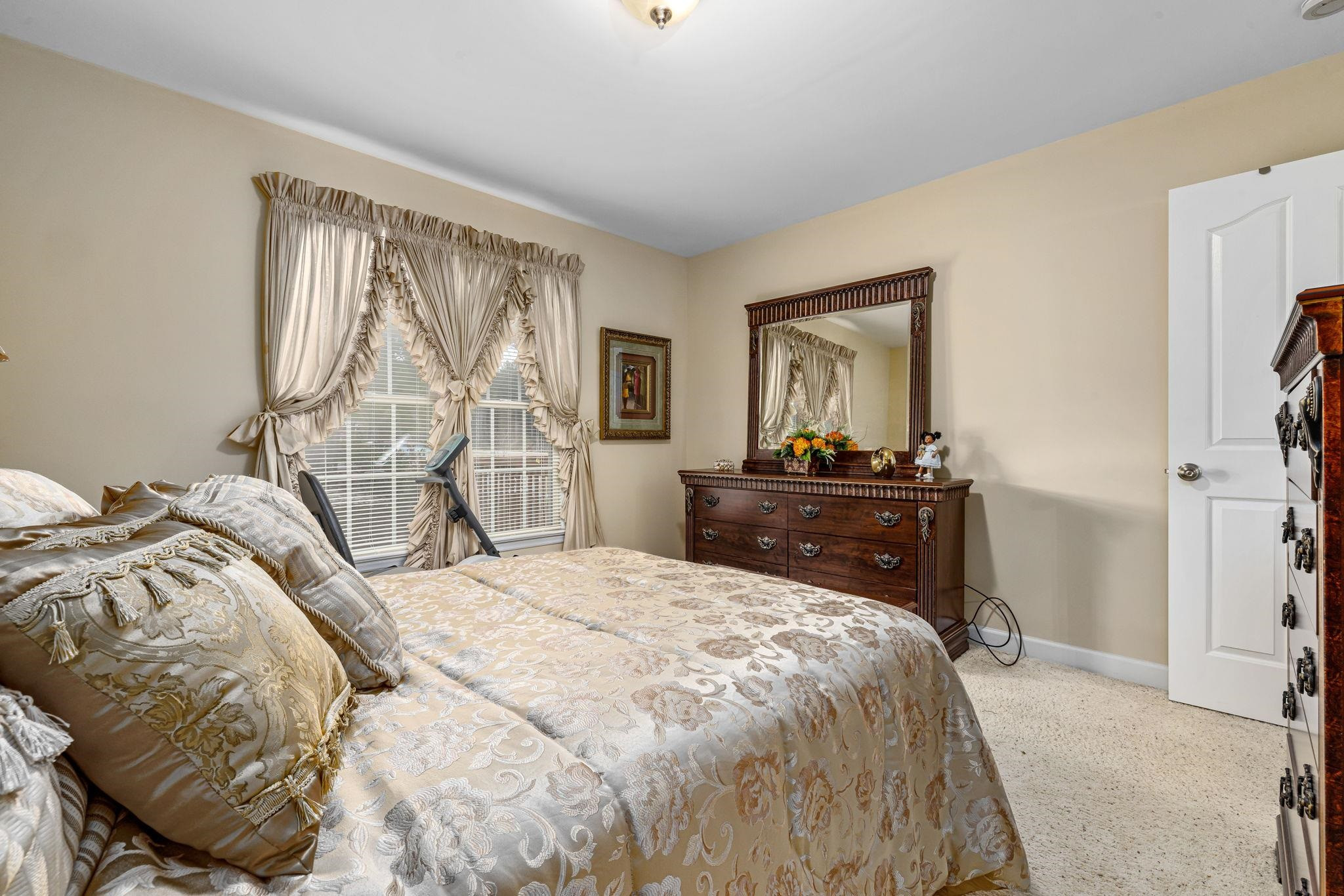 20 Crestline Drive Selma, NC 27576 - Photo 32 of 40 a bedroom with a bed and wooden floor