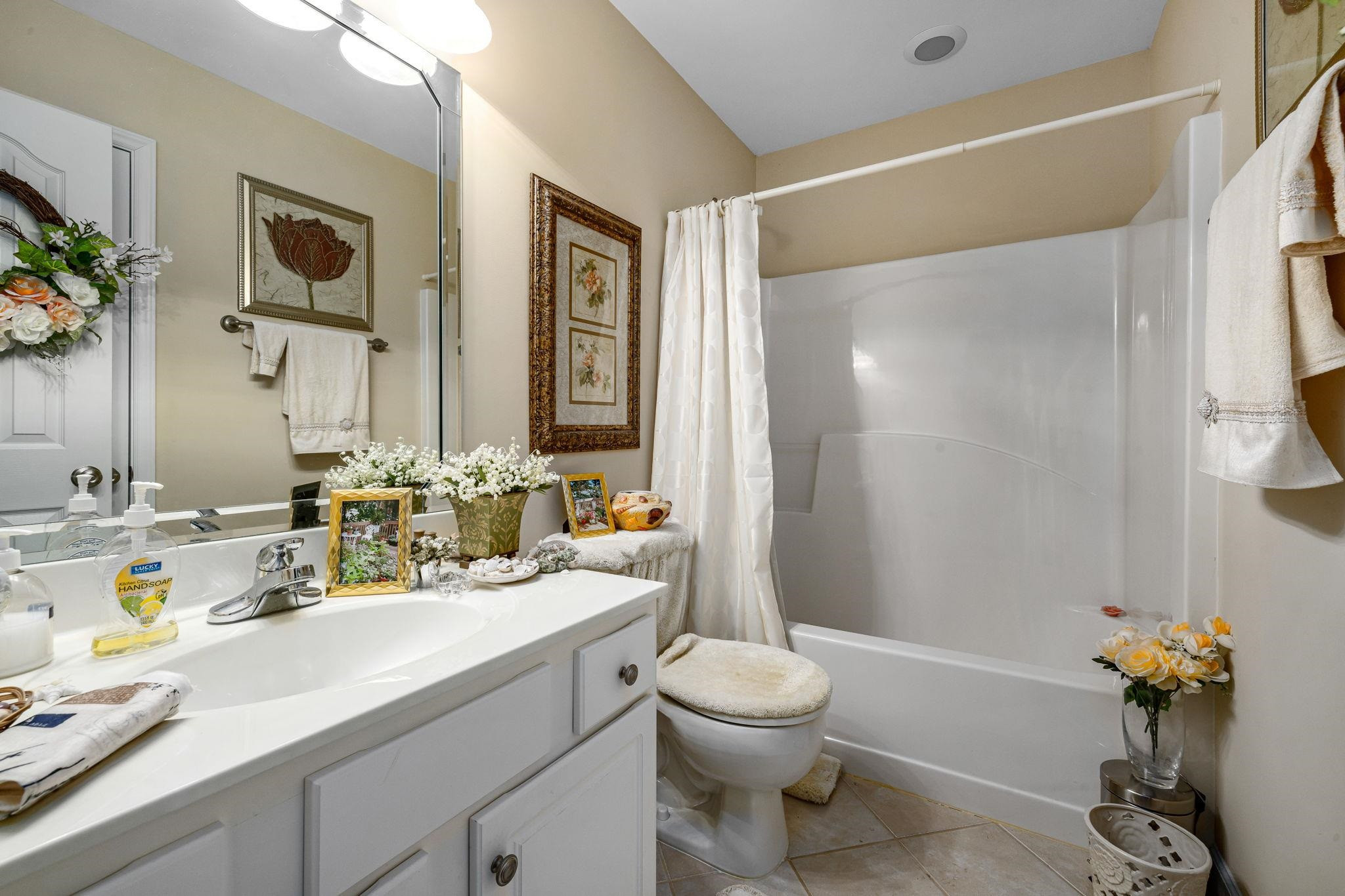 20 Crestline Drive Selma, NC 27576 - Photo 34 of 40 a bathroom with a sink a toilet and shower